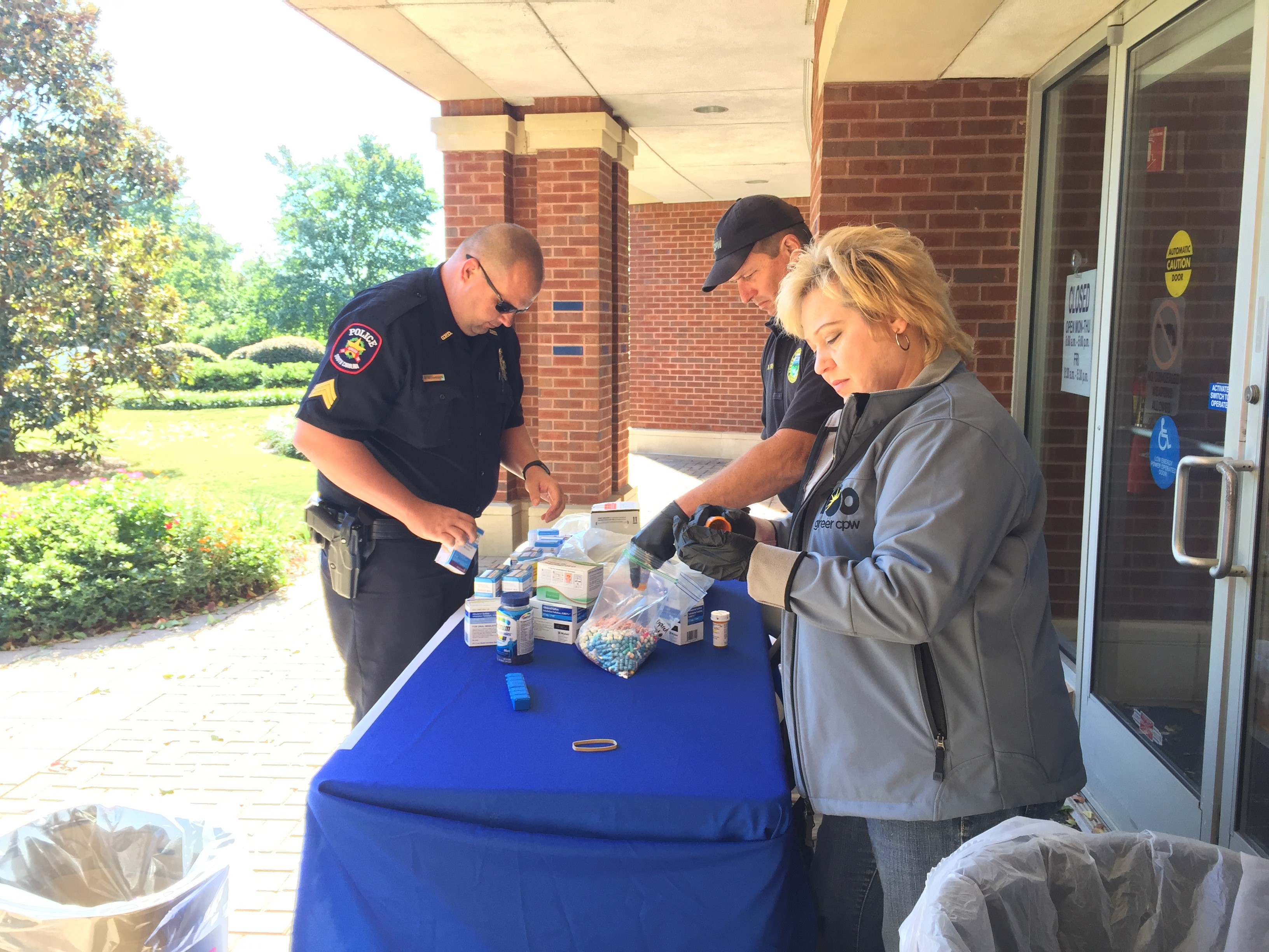 Greer Police Department and Greer CPW employees assist with the takeback event